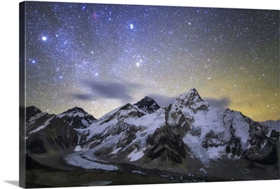 The bright stars of Auriga and Taurus rise above Mt Everest and the central Himalayas