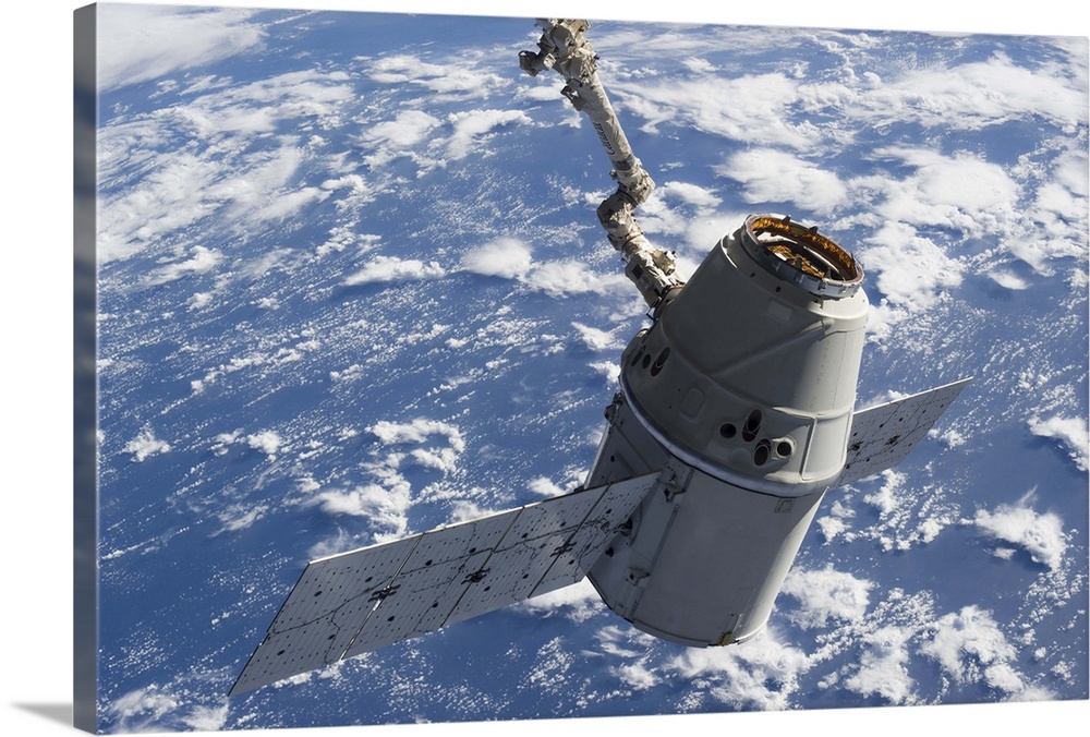 March 3, 2013 - The docking of SpaceX Dragon to the International Space Station backdropped by a blue and white Earth.