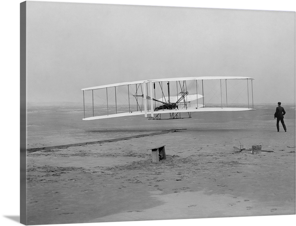 The first flight of the Wright Flyer in 1903.