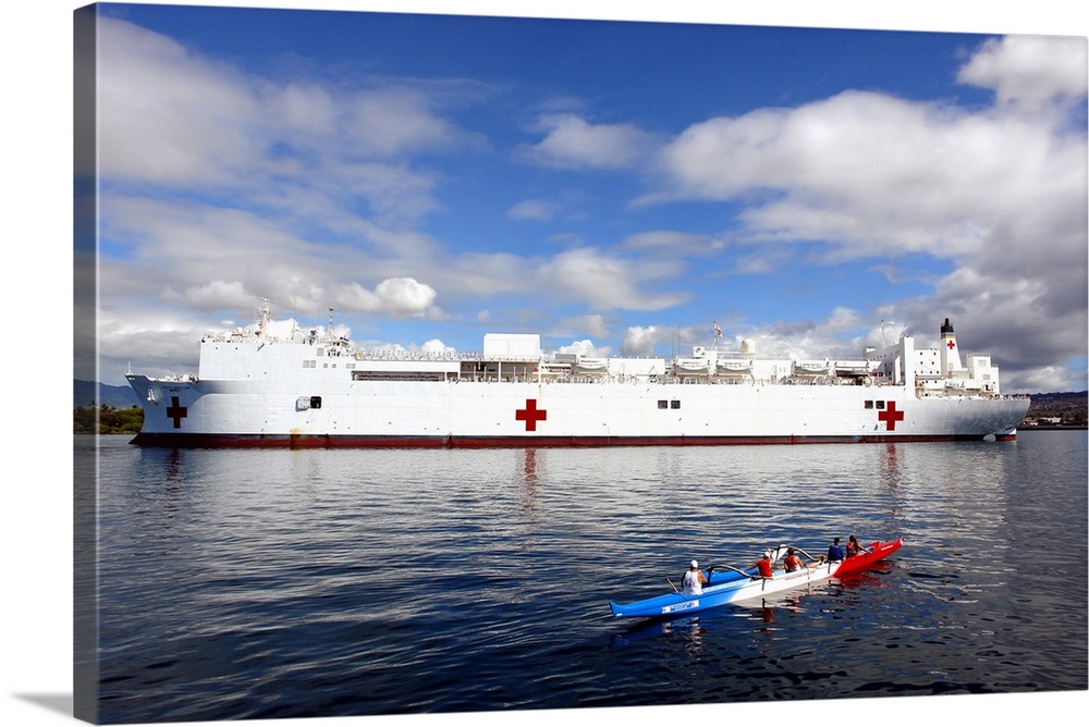 Pearl Harbor, May 2, 2006 - The Honolulu Pearl Canoe Club escorts the Military Sealift Command hospital ship USNS Mercy in...
