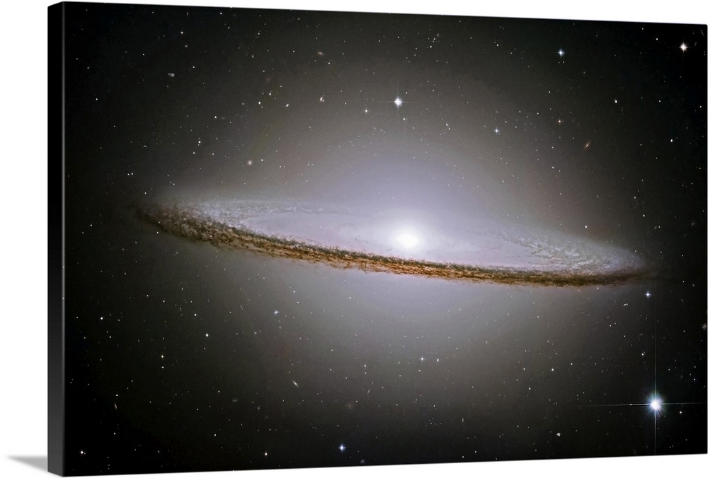 Landscape, oversized wall hanging of the Sombrero Galaxy radiating a halo of light, surrounded by stars.