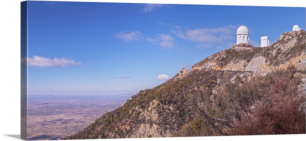 The Mayall Observatory sits atop Kitt Peak, overlooking the city of Tucson, Arizona in the distance.