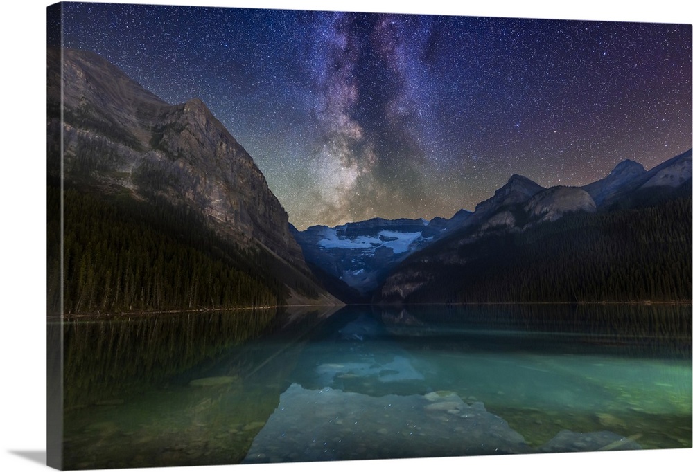 The Milky Way over glacier-fed Lake Louise and Victoria Glacier in Banff National Park, Alberta, Canada