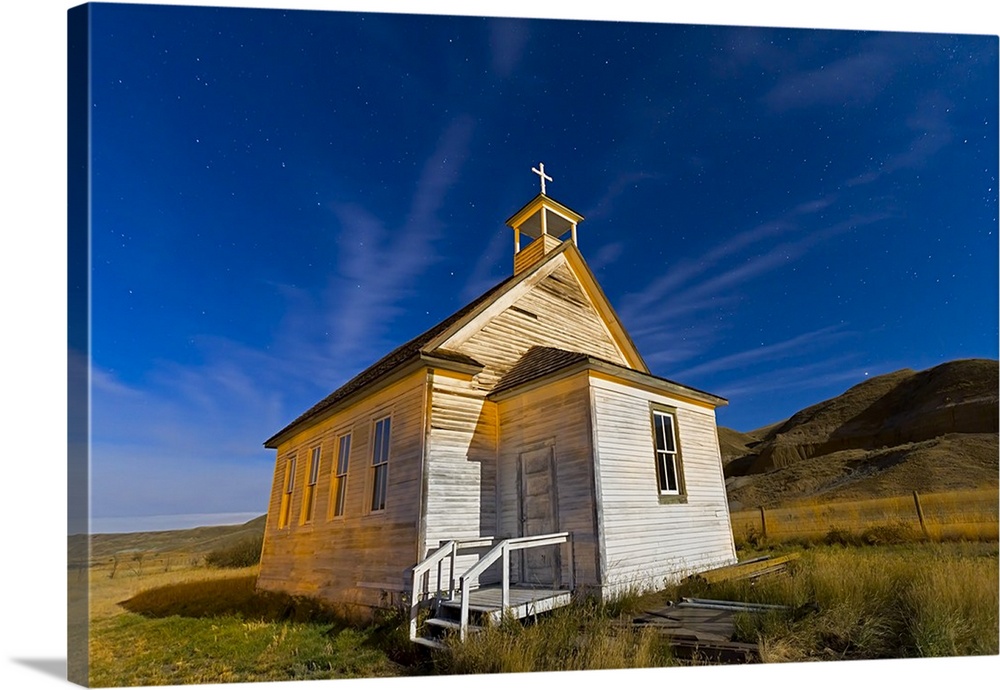 October 9, 2011 - The old pioneer church in Dorothy, Alberta, Canada, on a starry night illuminated by moonlight.
