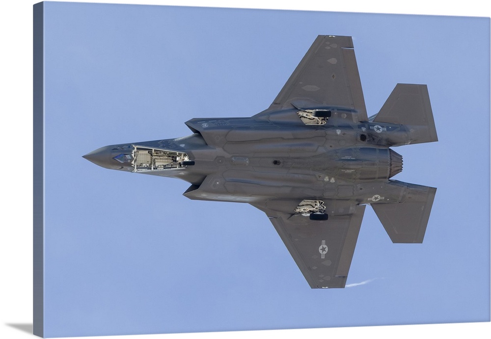 The underside of a U.S. Air Force F-35A Lightning II as it turns on to final approach at Nellis Air Force Base, Nevada.