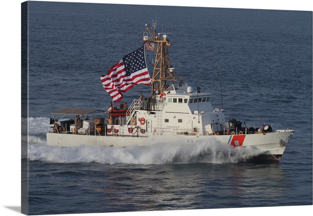 The U.S. Coast Guard Cutter Adak  transits at maximum speed.