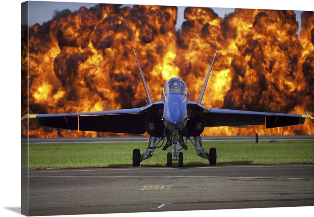 The Wall of Fire is set off behind the U.S. Navy Blue Angel demonstration team.