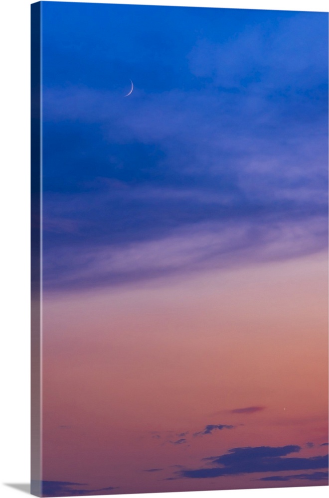 The Waxing 3-Day-Old Crescent Moon Above Venus Amidst A Summer Sunset
