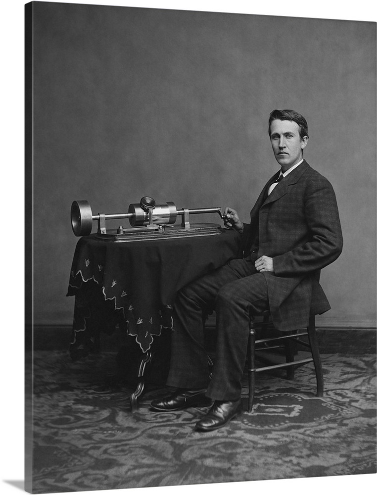 American inventor and businessman, Thomas Edison with his second phonograph, circa 1878.