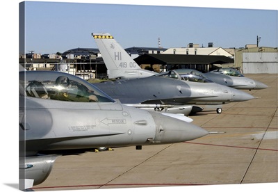 Three F-16 Fighting Falcons prepare to taxi for departure