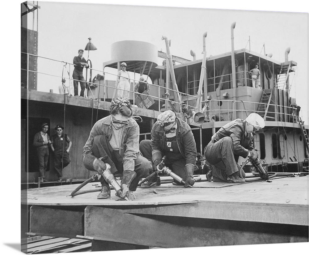 Three women chippers working in a shipbuilding shipyard, 1942.