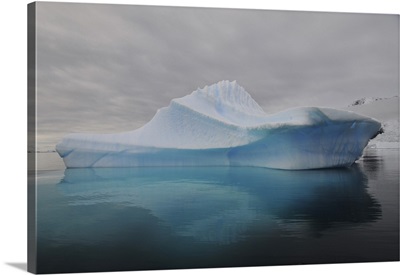 Translucent blue iceberg reflection, Antarctica