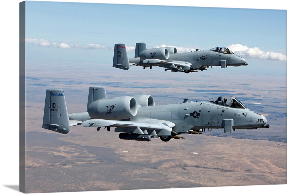 Two A-10 Thunderbolt's from the 124th Fighter Wing fly over the Saylor Creek bombing range in Central Idaho.