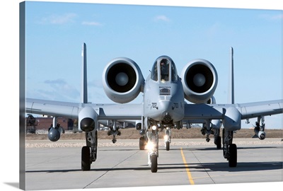 Two A-10 Thunderbolts taxi to the runway
