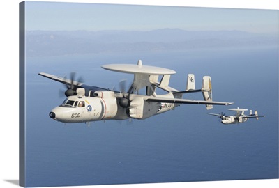 Two E-2C Hawkeye aircraft fly over the Pacific Ocean