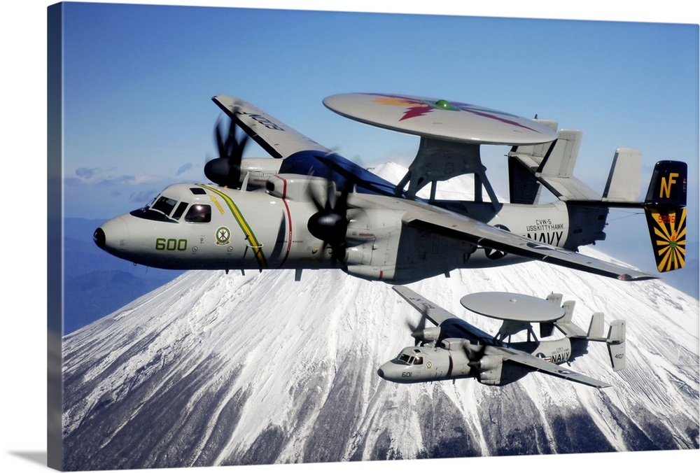 Two E2C Hawkeyes conduct a flyby of Mount Fuji in Japan