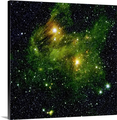 Two extremely bright stars illuminate a greenish mist in deep space