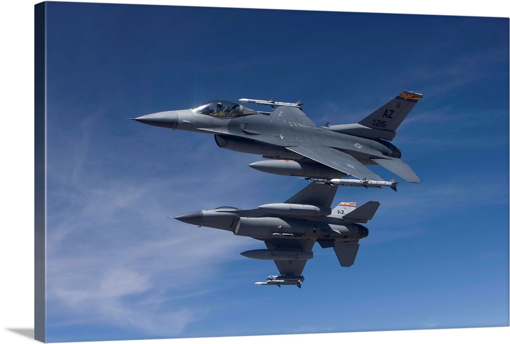 Two F-16's from the 162nd Fighter Wing manuever on an air-to-air training mission.
