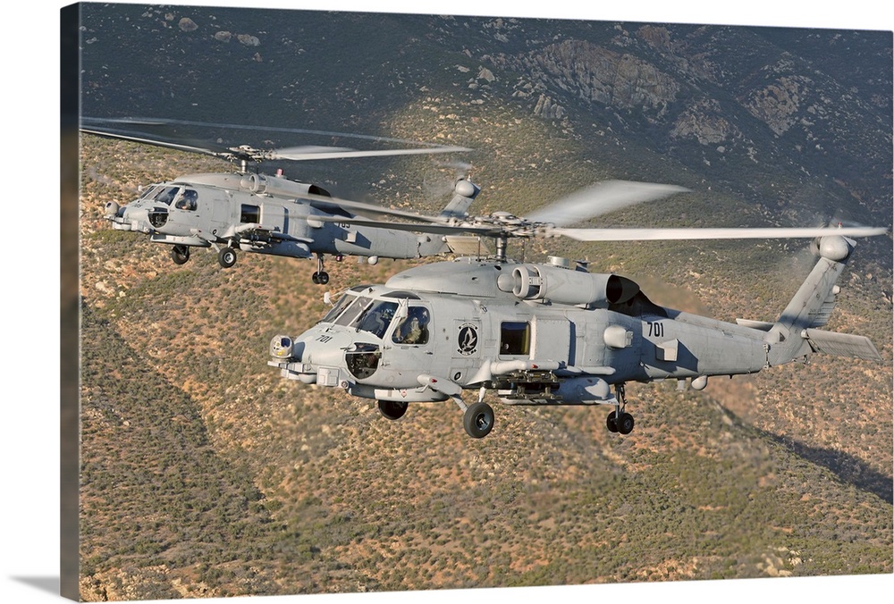 Two MH-60 helicopters of the U.S. Navy Blue Hawks squadron flying over Fallon, Nevada.