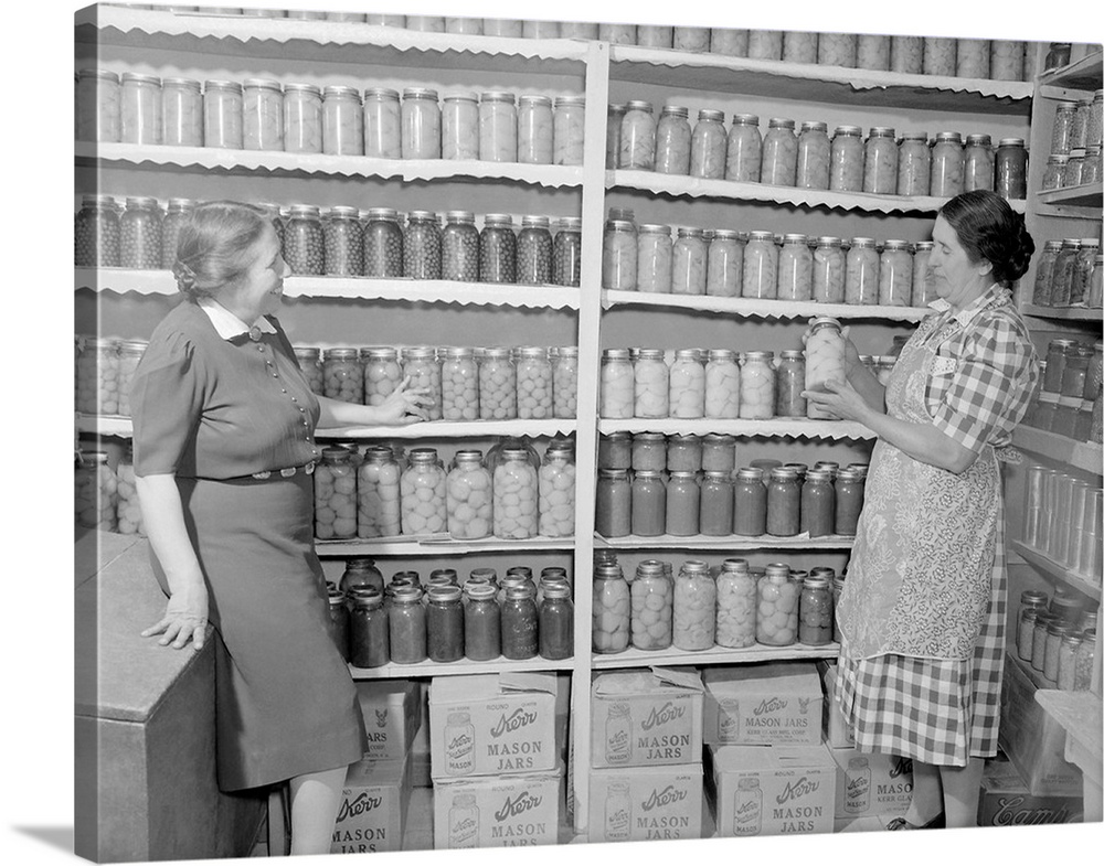 Two women standing in a kitchen pantry, circa 1946.