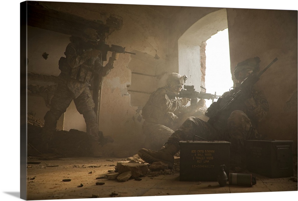 This is a horizontal photograph of three soldiers in a damaged interior peering out a window.