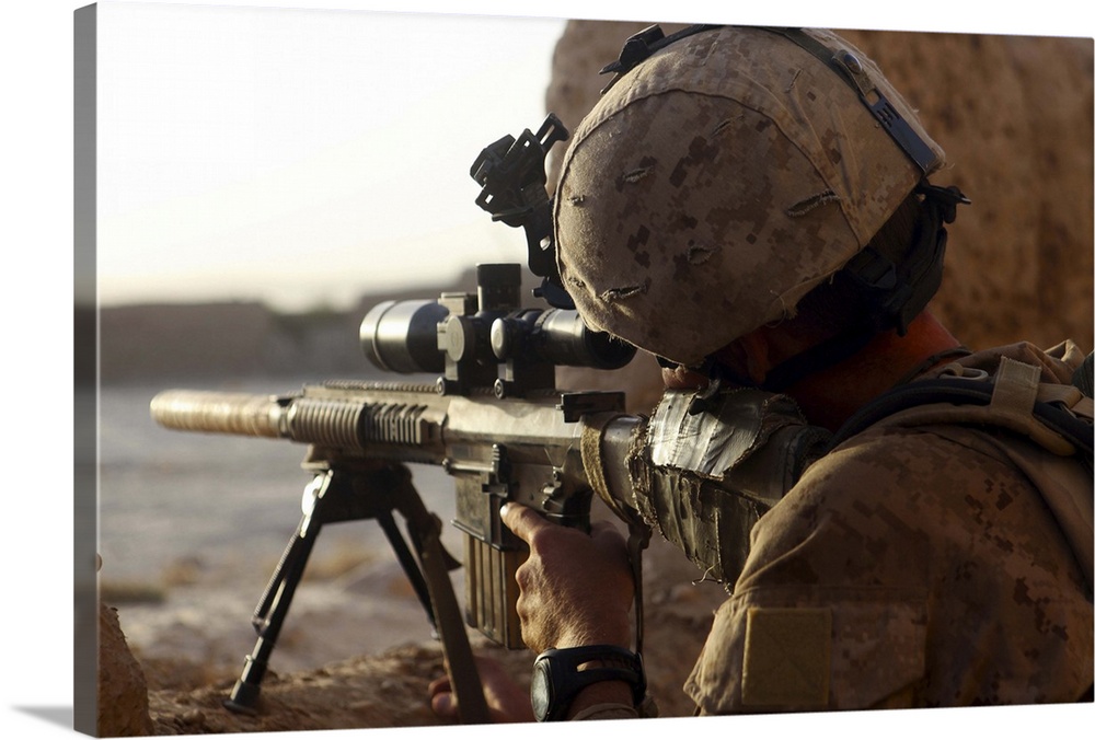 October 20, 2010 - U.S. Marine with Scout Sniper Platoon, looks through the scope of his M16A4 rifle for enemy forces duri...