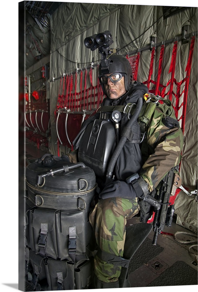 U.S. Navy Seal combat diver prepares for HALO jump operations from a C-130 Hercules.