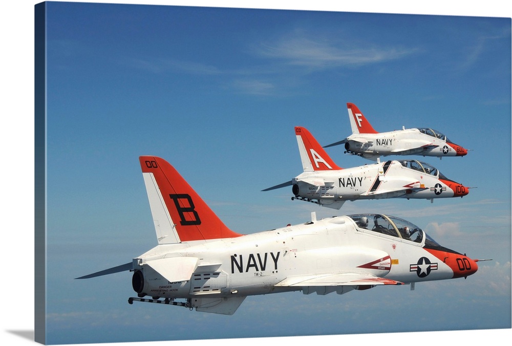 August 26, 2010 - U.S. Navy T-45 Goshawk training aircraft fly in formation over the aircraft carrier USS George H.W. Bush...
