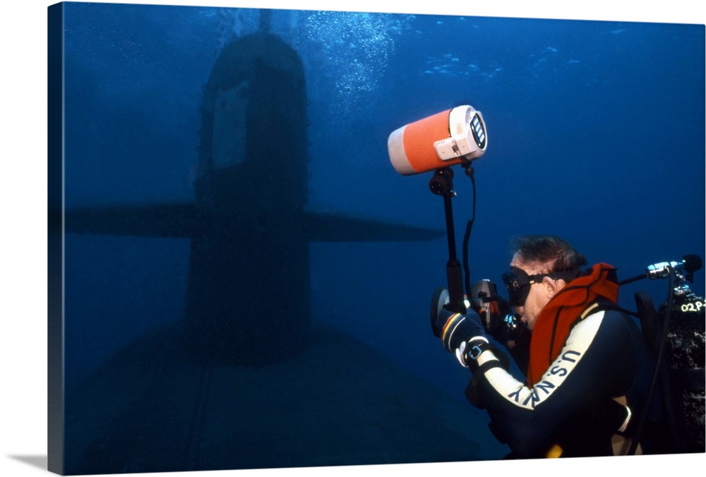 Underwater photographer takes photos of a US submarine