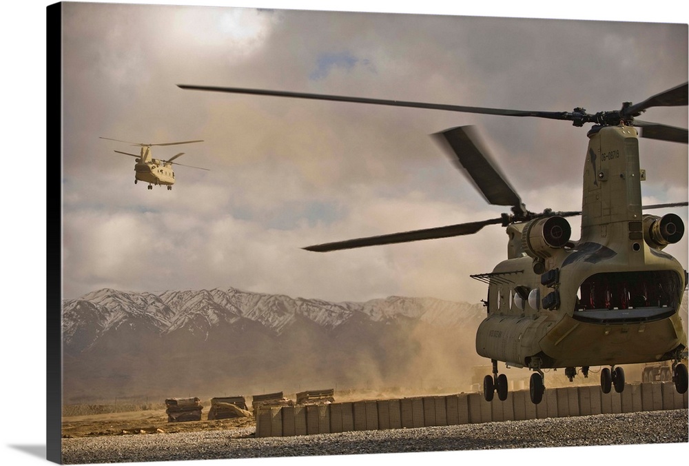 U.S. Army CH-47 Chinook helicopters depart a military base in Afghanistan.