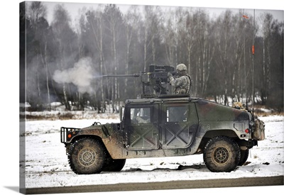 US Army Paratrooper Fires An M2 50-Caliber Machine Gun Atop A Humvee
