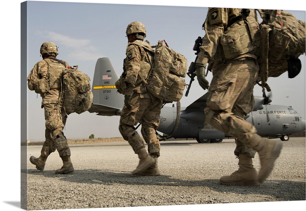 September 23, 2013 - Army 101st Airborne Division Soldiers make their way to a 774th Expeditionary Airlift Squadron C-130 ...