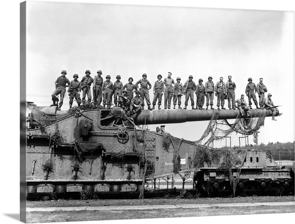U.S. Army soldiers stand on top of a large 274mm railroad gun, 1945.