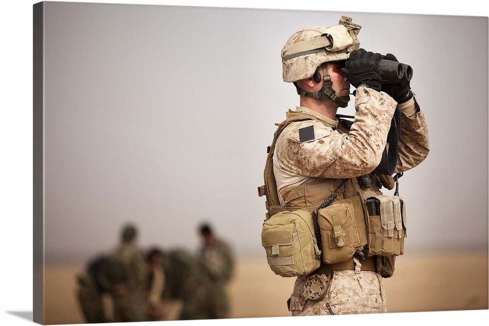 February 21, 2012 - U.S. Marine determines target placement at the Shamshad target range in Afghanistan.