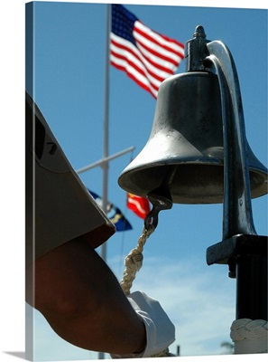 US Marine sounds a bell honoring fallen Marines during a ceremony