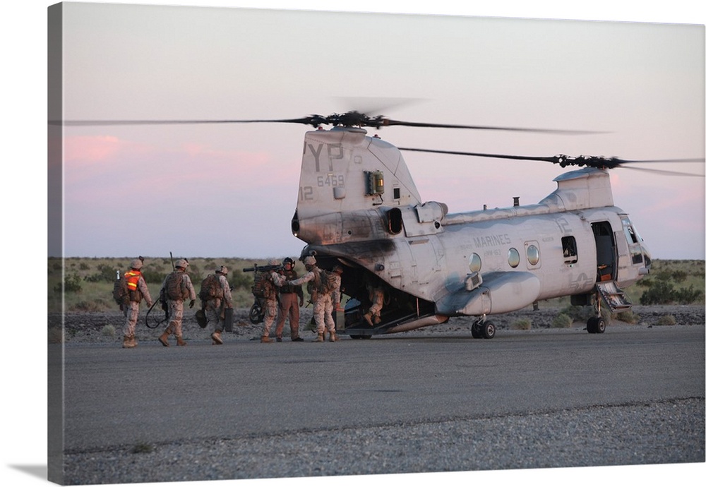 U.S. Marines board a CH-46 Sea Knight helicopter.