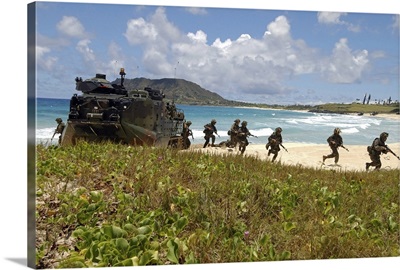US Marines run out of an Amphibious Assault Vehicle