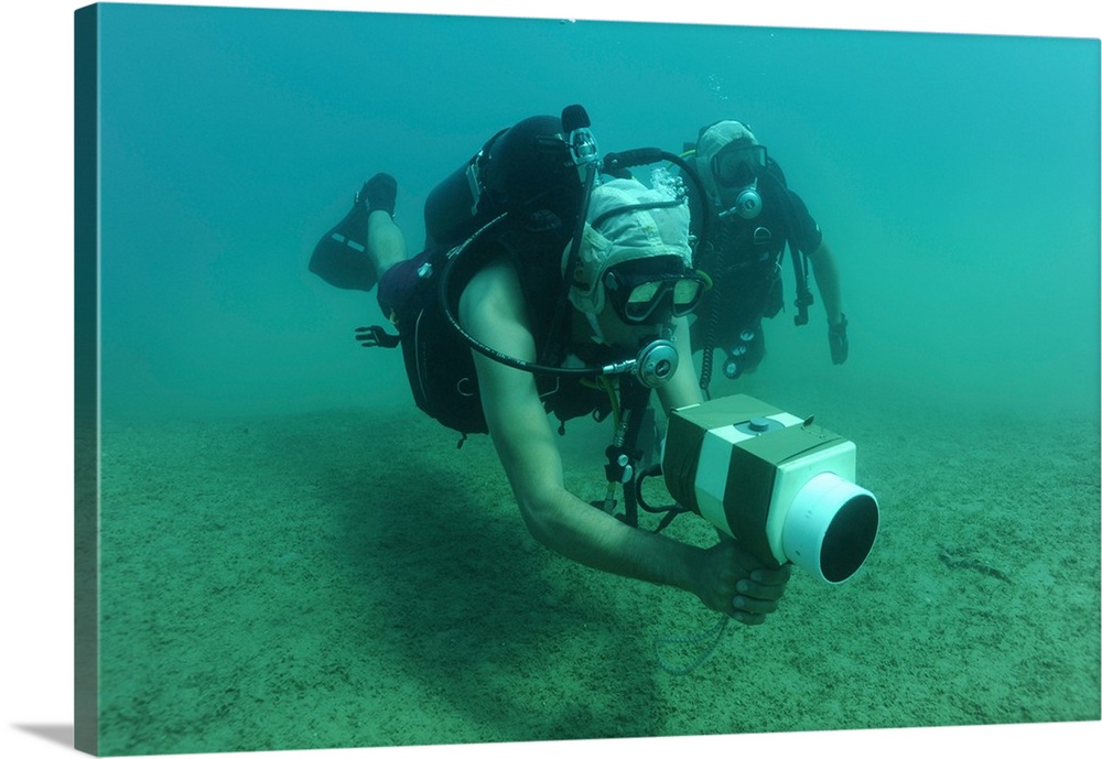 U.S. Navy diver uses an AN/PQS 2A handheld sonar device while training in the Red Sea.