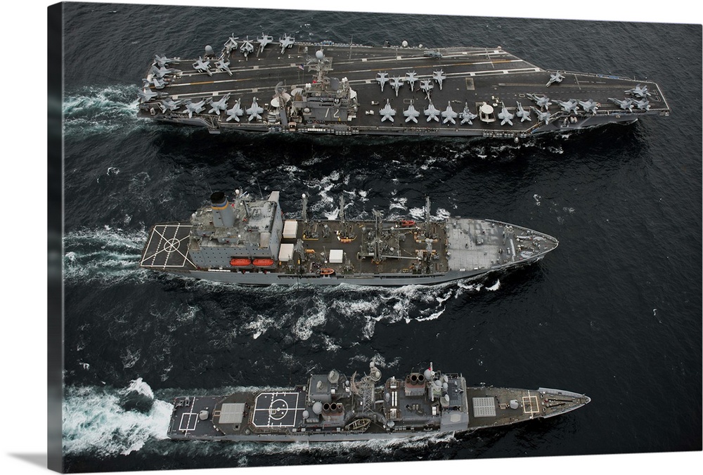 U.S. Navy ships conduct a replenishment at sea in the Pacific Ocean.