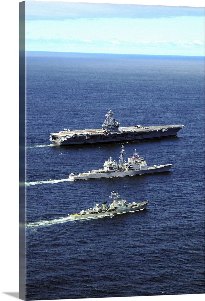 U.S. Navy ships perform tactical maneuvering exercises in the Atlantic Ocean.