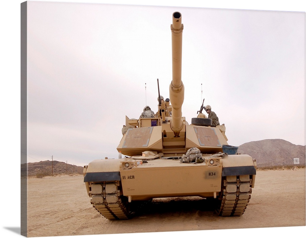 U.S. soldiers perform maintenance on their M1 Abrams tank.