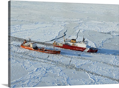 USCG Healy breaks ice around a Russian-flagged tanker south of Nome, Alaska