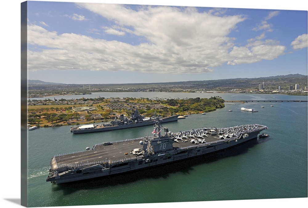 USS Carl Vinson passes the USS Missouri Memorial in Pearl Harbor.