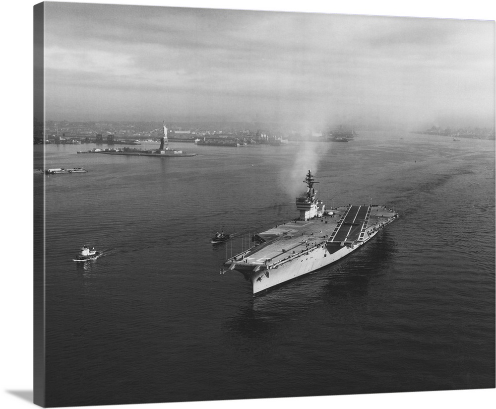 November 4, 1961 - USS Constellation (CVA-64) leaving New York Harbor for builder's trials. The Statue of Liberty is in th...