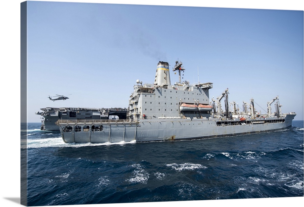 USS George H.W. Bush performs a replenishment-at-sea with USNS Tippecanoe.