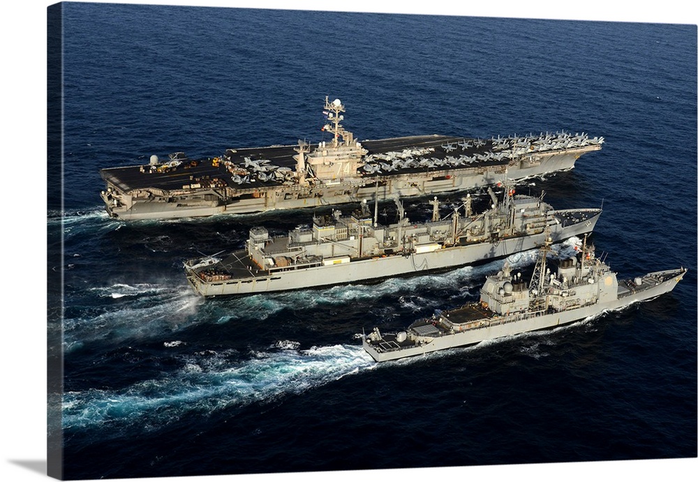 USS John C. Stennis, USS Mobile Bay and USNS Bridge during a replenishment at sea.