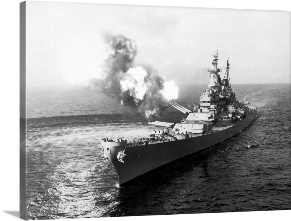 USS Missouri firing her 16 inch guns towards Chong Jin, Korea, 1950.