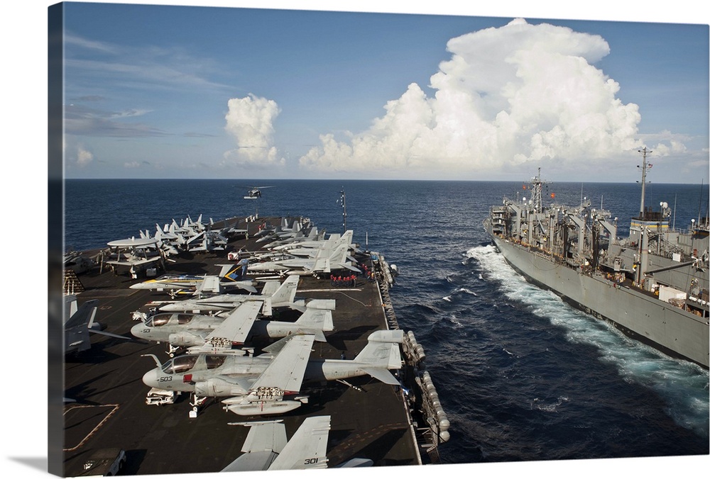 South China Sea, May 21, 2013 - The aircraft carrier USS Nimitz (CVN-68) and the Military Sealift Command fast combat supp...