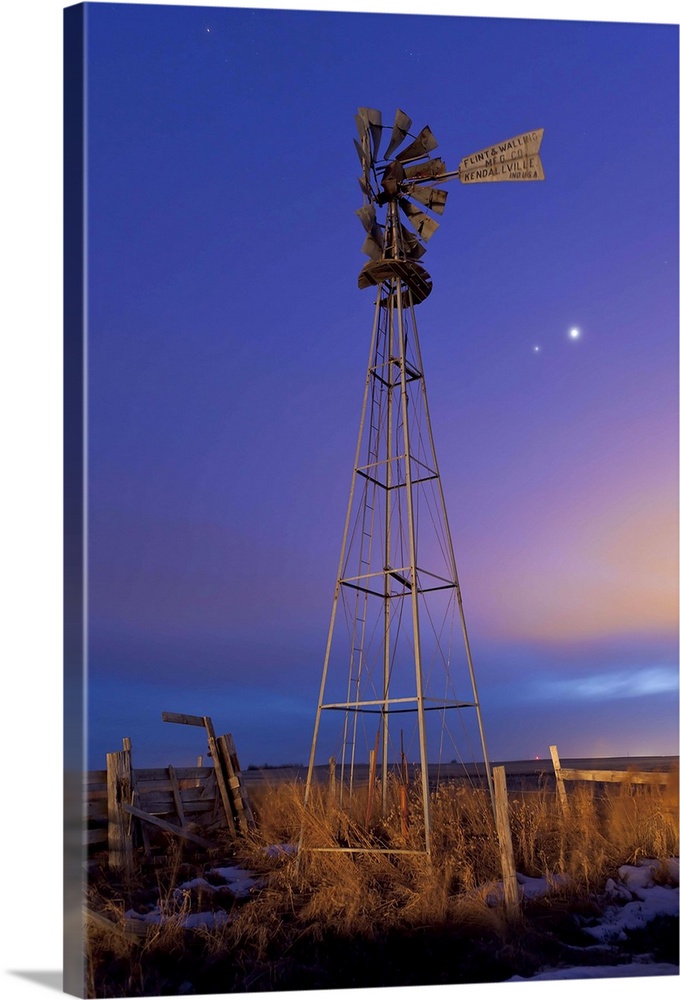 March 12, 2012 - Venus and Jupiter are visible behind an old farm water pump windmill on Glenmore Trail east of Langdon, A...