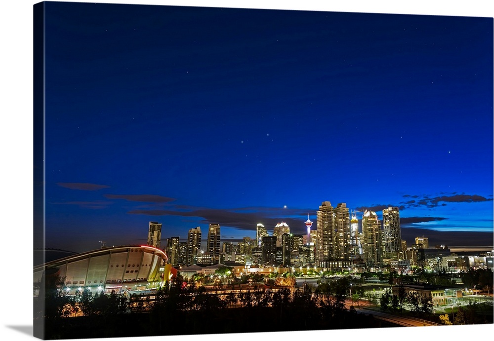 Venus and stars setting over the skyline of Calgary, Canada.